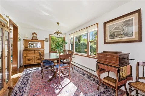 a living room with furniture a window and a bookshelf