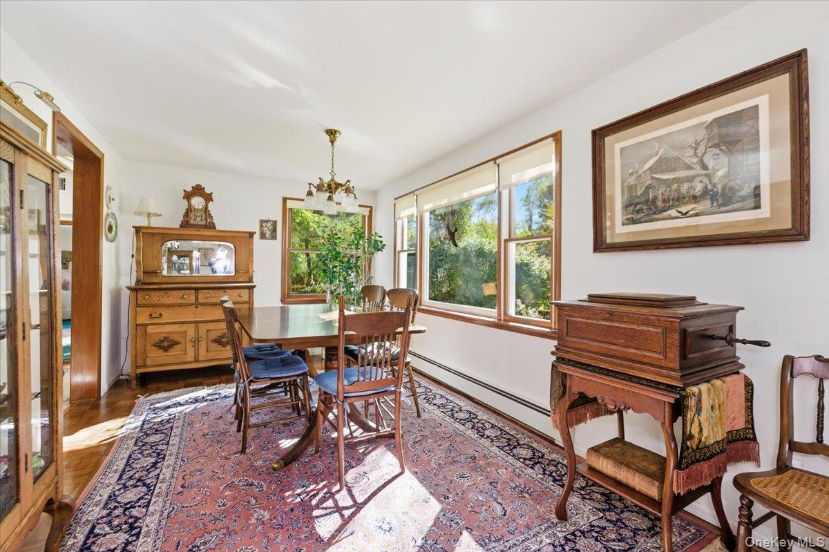 27 Cold Spring Hills Road Huntington, NY 11743 - Photo 7 of 48 a living room with furniture a window and a bookshelf