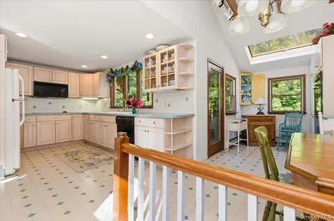 a kitchen with stainless steel appliances kitchen island granite countertop a sink and cabinets