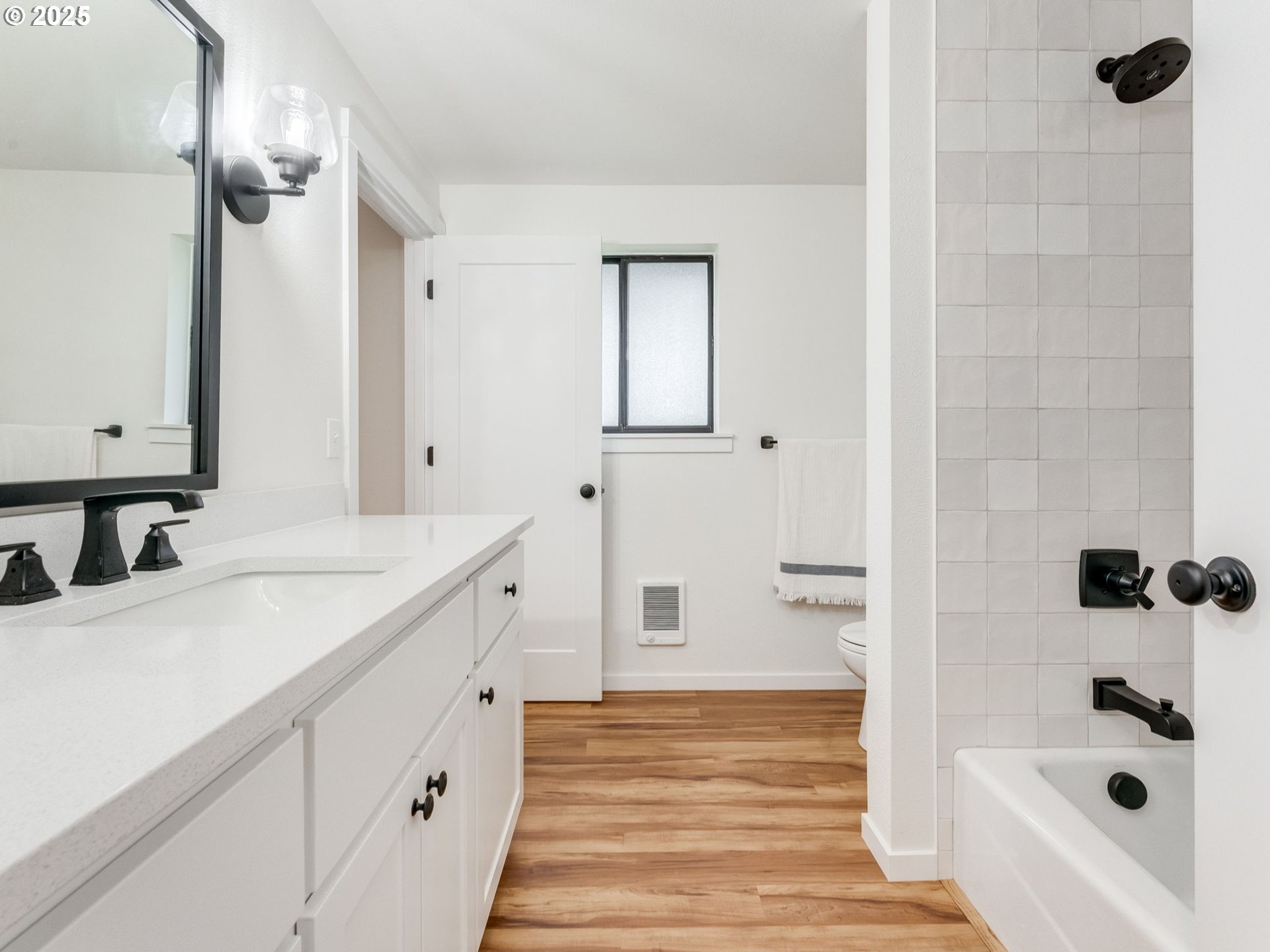 17925 Beebee Court Sandy, OR 97055 - Photo 21 of 48 a bathroom with a double vanity sink a mirror and a bathtub