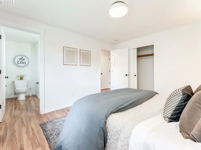 a bedroom with a bed and a couch