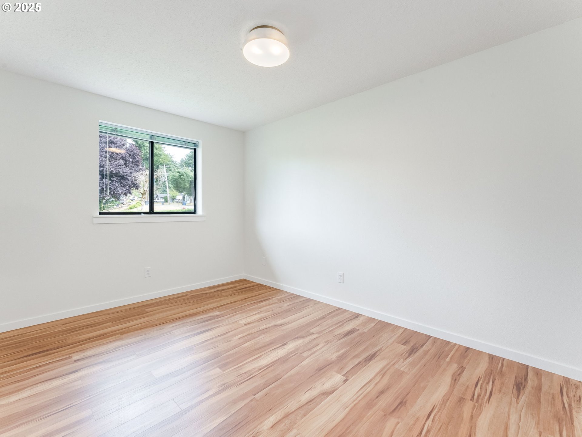 17925 Beebee Court Sandy, OR 97055 - Photo 29 of 48 an empty room with wooden floor and windows
