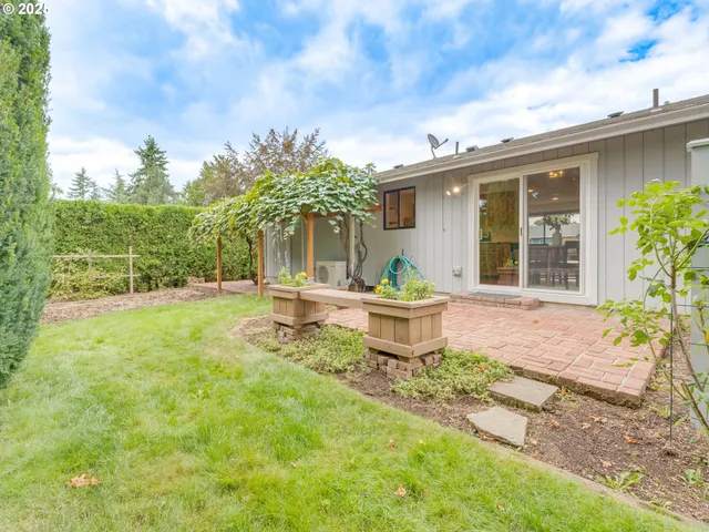 a house with garden in front of it