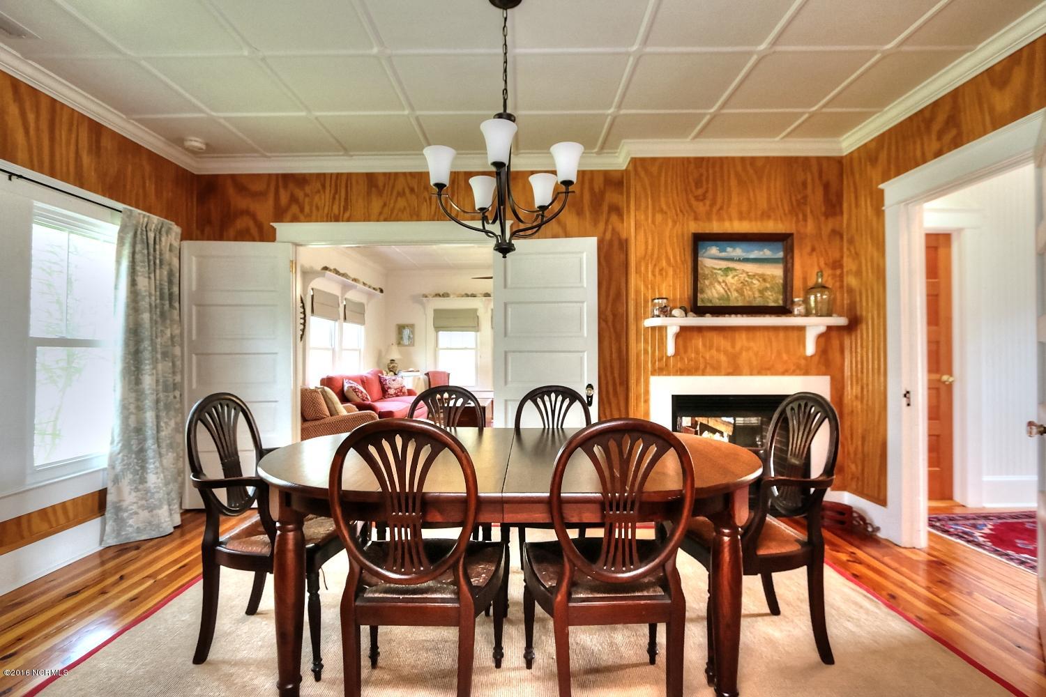 227 Horseshoe Road Davis, NC 28524 - Photo 16 of 74 Formal Dining Room with Fireplace