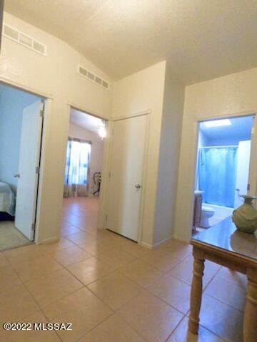 13643 East Bright Sky Loop Vail, AZ 85641 - Photo 10 of 22 a view of a hallway with wooden floor and furniture