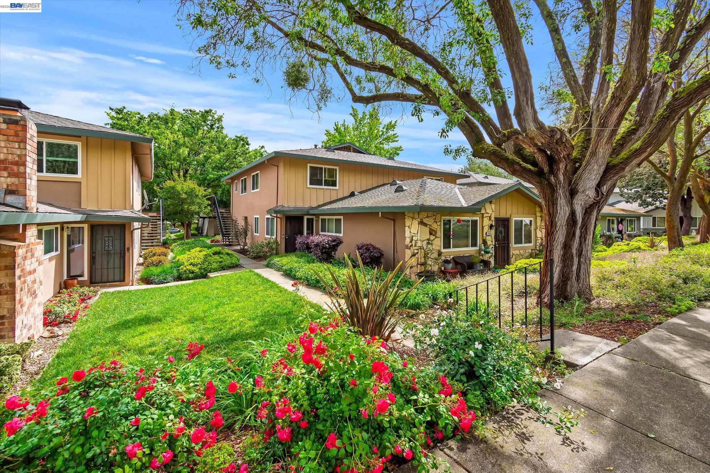 2243 Segundo Court, Unit 2 Pleasanton, CA 94588 - Photo 1 of 22 a front view of a house with a yard