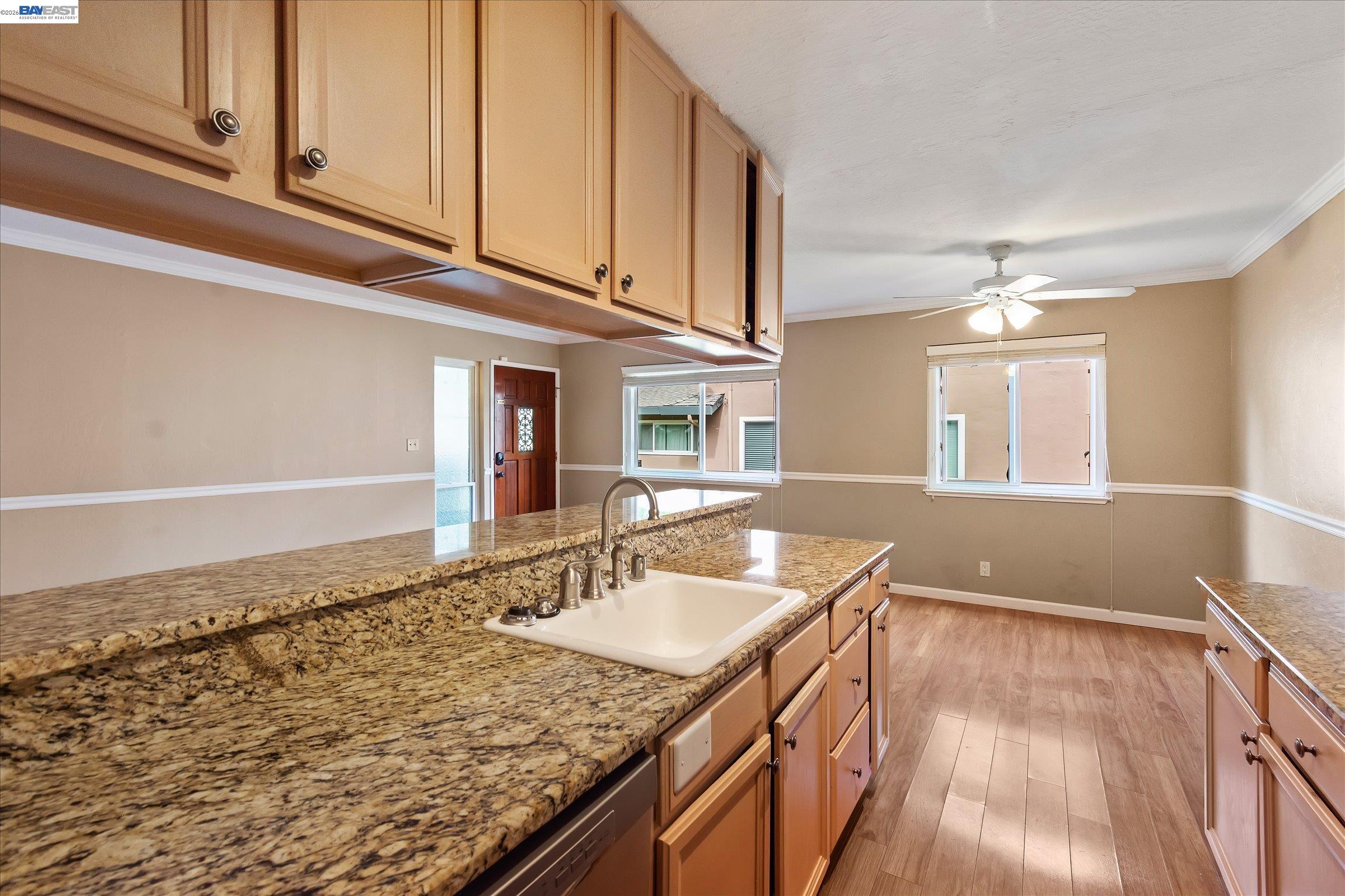 2243 Segundo Court, Unit 2 Pleasanton, CA 94588 - Photo 13 of 22 a kitchen with a sink stove and cabinets
