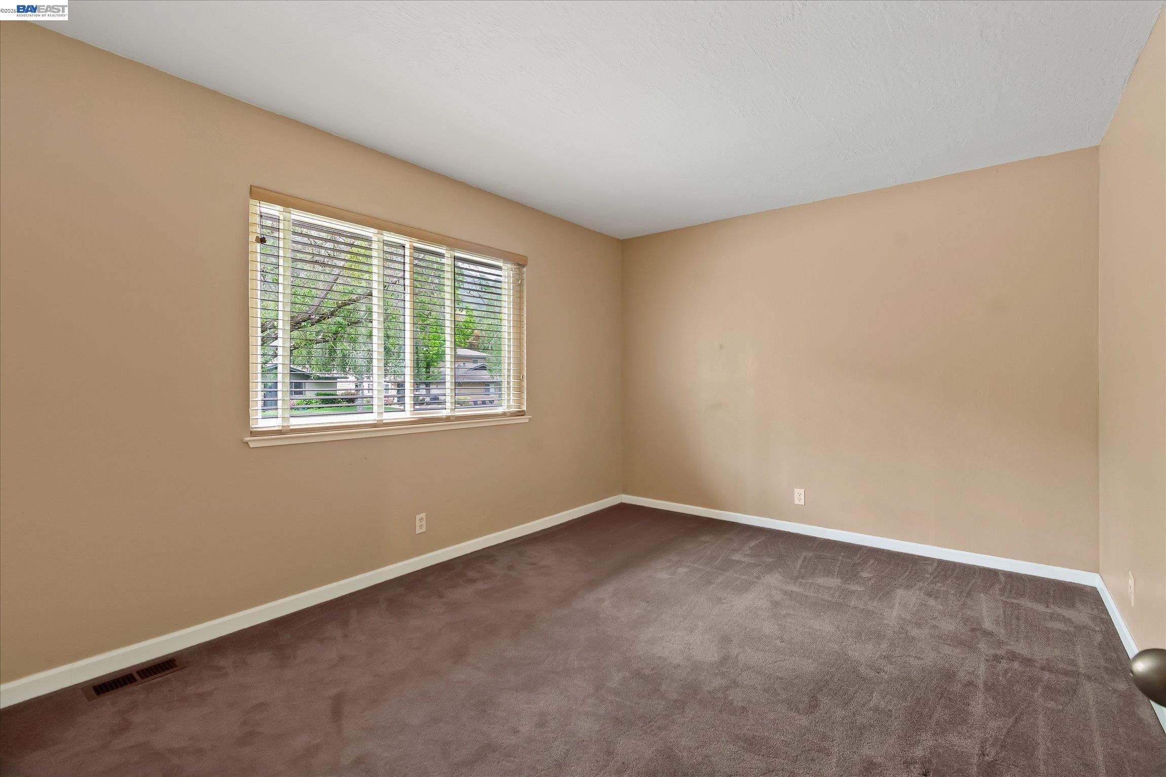 2243 Segundo Court, Unit 2 Pleasanton, CA 94588 - Photo 15 of 22 an empty room with a window