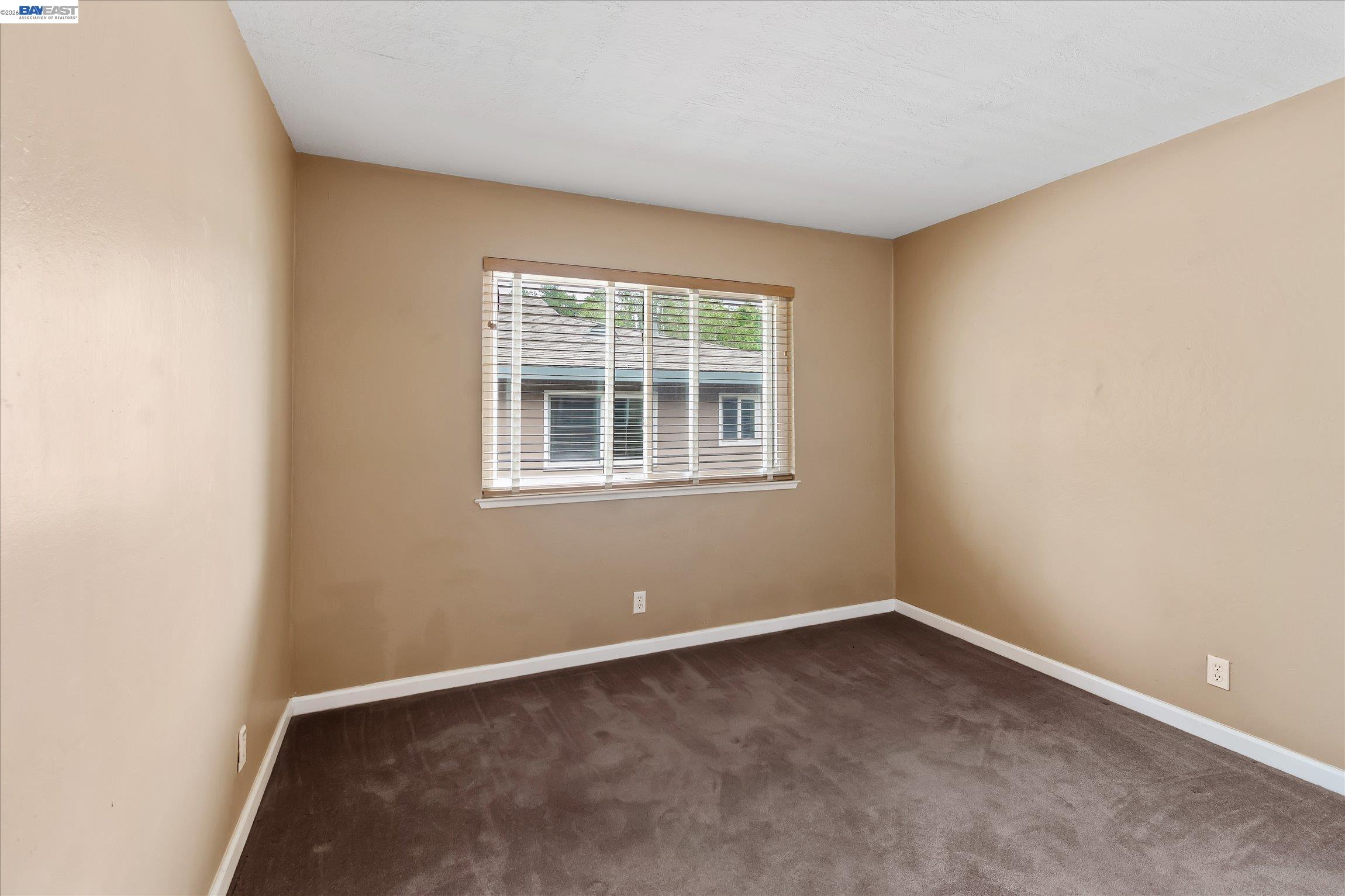 2243 Segundo Court, Unit 2 Pleasanton, CA 94588 - Photo 17 of 22 an empty room with a window