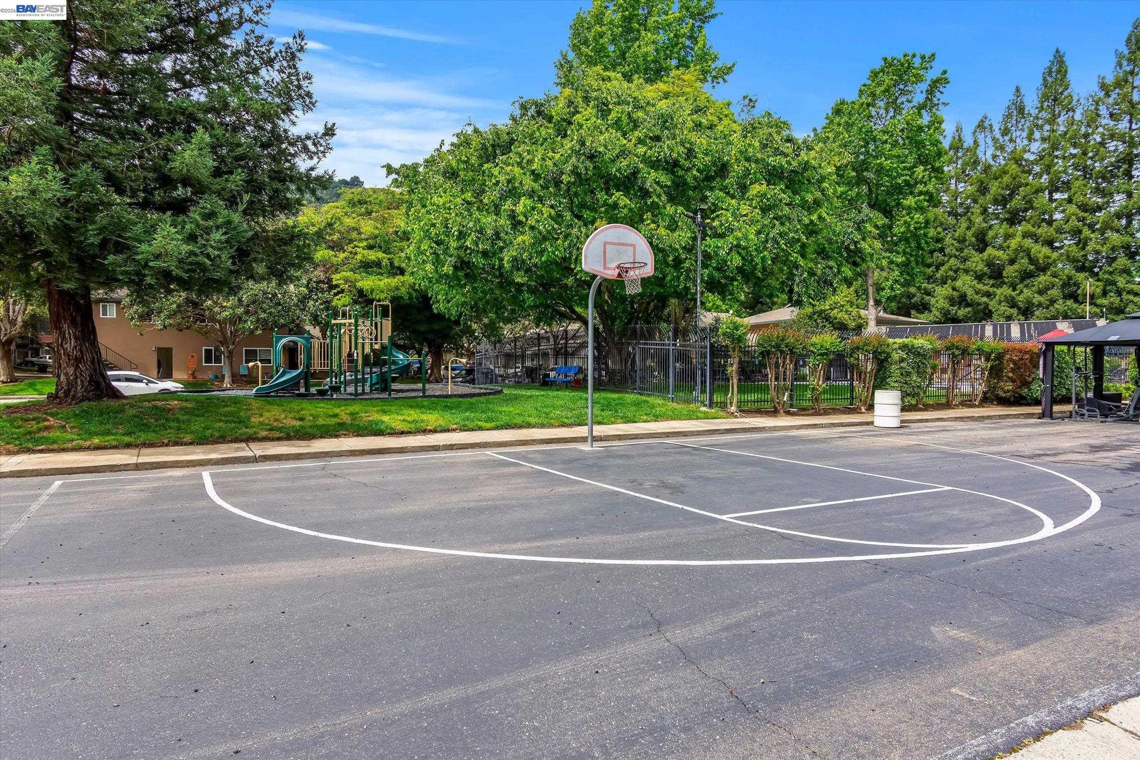 2243 Segundo Court, Unit 2 Pleasanton, CA 94588 - Photo 19 of 22 a view of a playground with basketball court