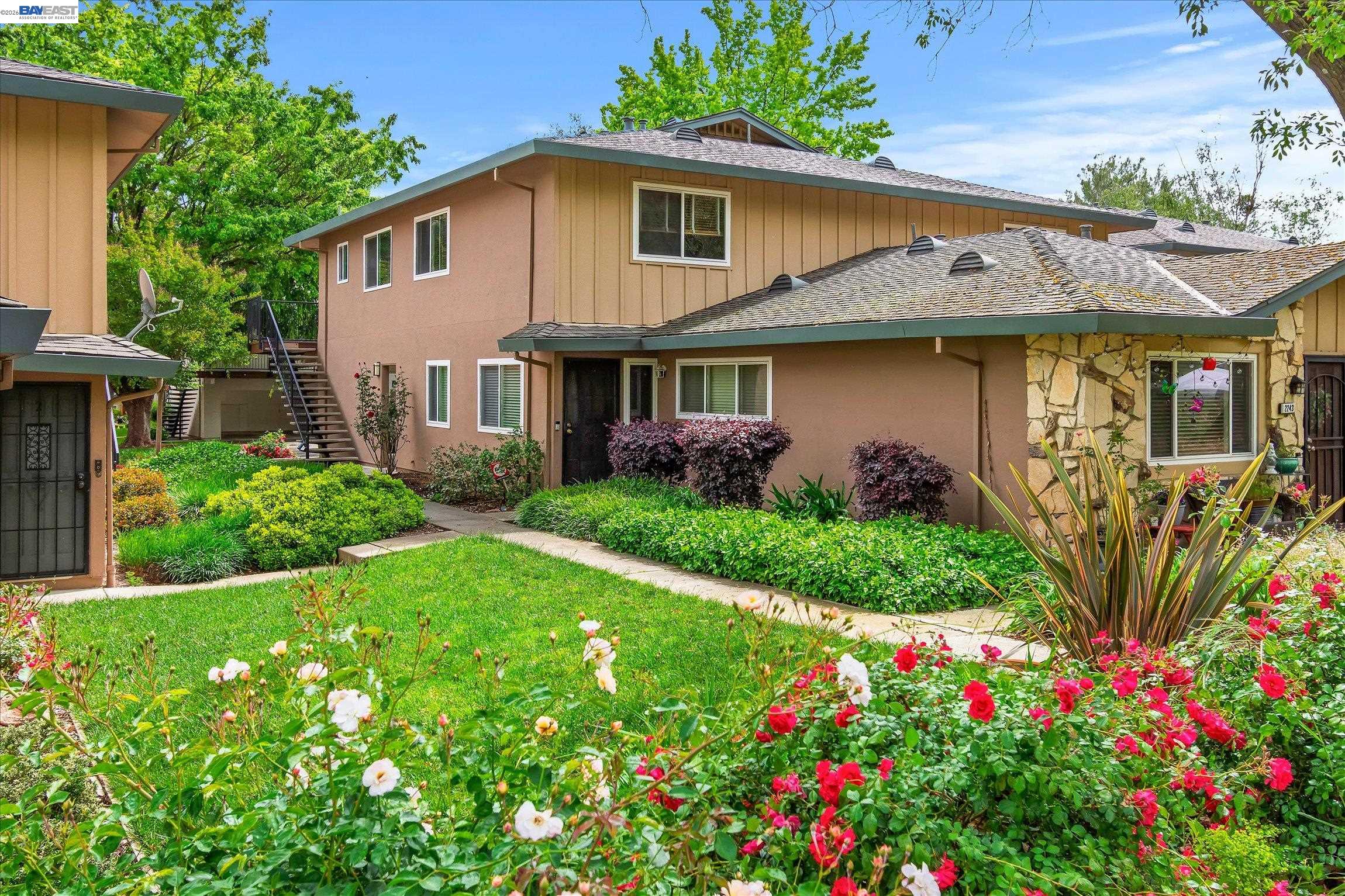 2243 Segundo Court, Unit 2 Pleasanton, CA 94588 - Photo 2 of 22 a front view of a house with garden