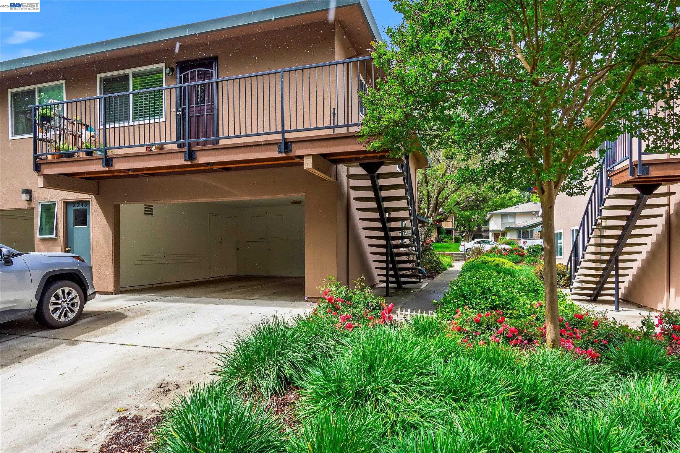 2243 Segundo Court, Unit 2 Pleasanton, CA 94588 - Photo 4 of 22 a house with trees in the background