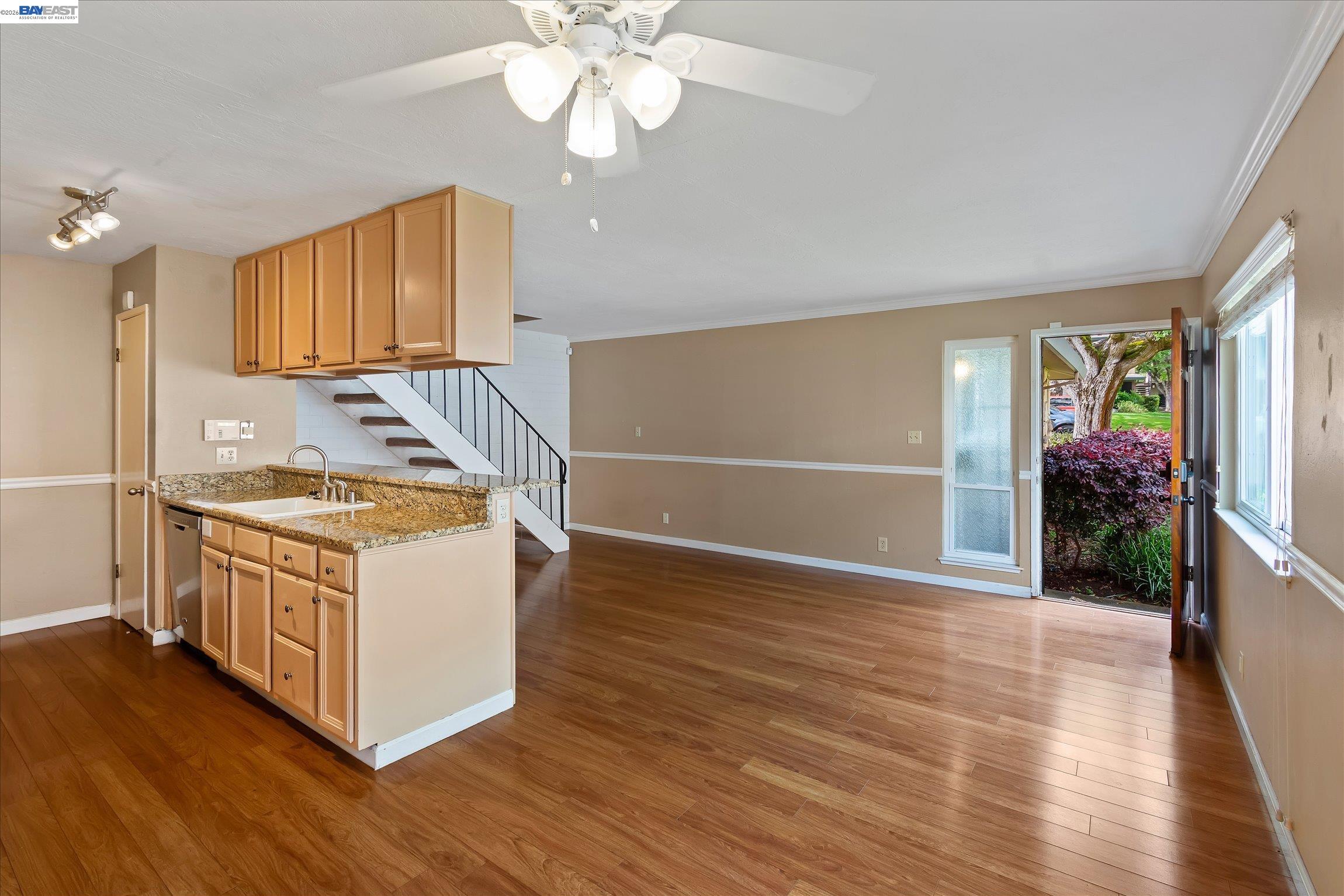 2243 Segundo Court, Unit 2 Pleasanton, CA 94588 - Photo 5 of 22 a kitchen with stainless steel appliances granite countertop a sink a stove a refrigerator cabinets and wooden floor