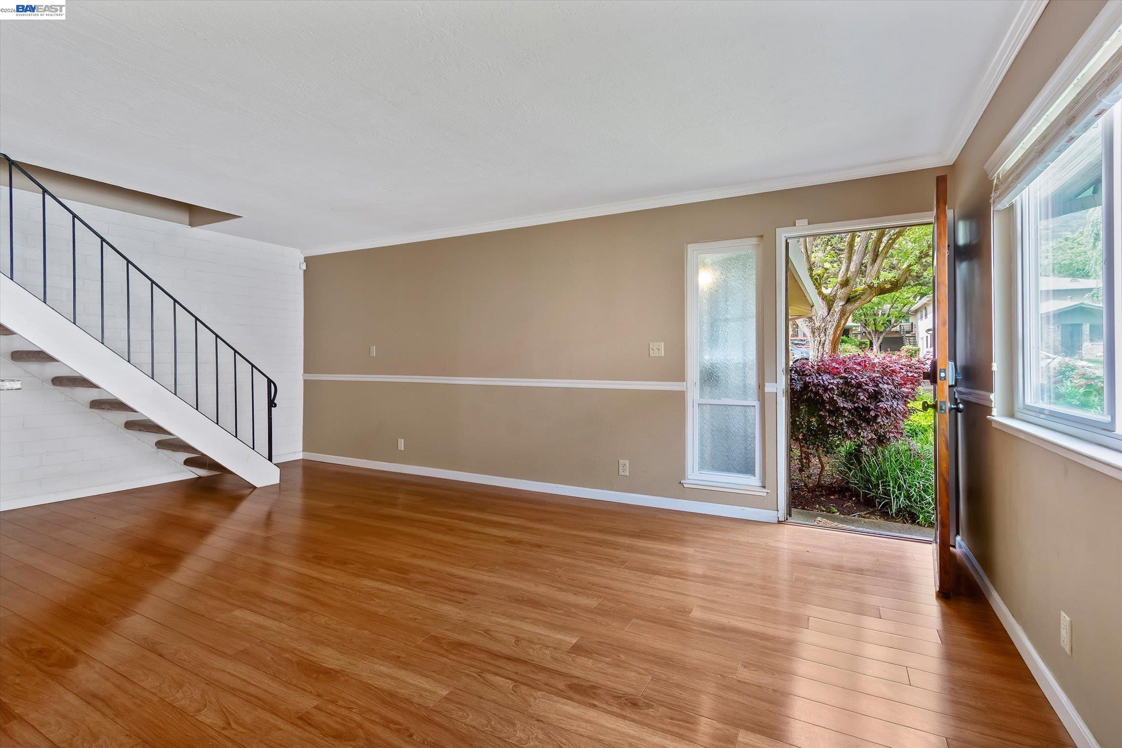 2243 Segundo Court, Unit 2 Pleasanton, CA 94588 - Photo 6 of 22 a view of an empty room with wooden floor and a window
