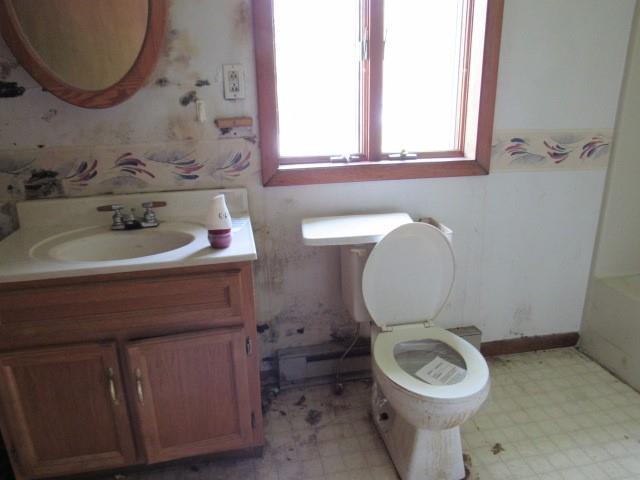 345 Unity Cemetery Road Latrobe, PA 15650 - Photo 12 of 18 a bathroom with a toilet sink and mirror