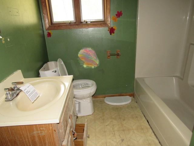 345 Unity Cemetery Road Latrobe, PA 15650 - Photo 8 of 18 a white toilet sitting next to a bathroom sink and tub