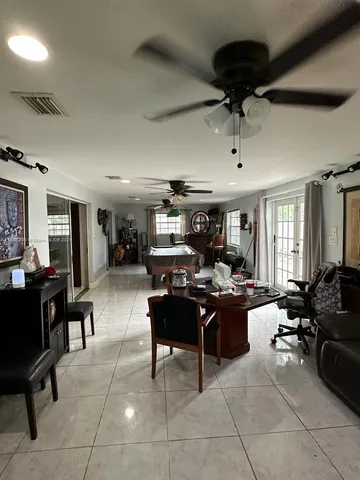 a view of a livingroom with furniture window and wooden floor