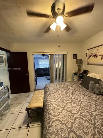 a bedroom with a bed and dresser