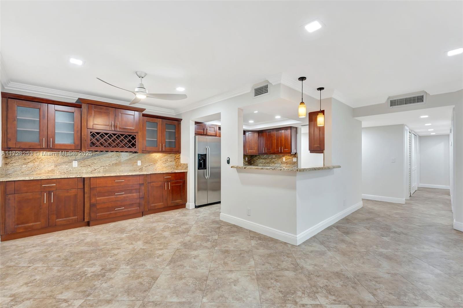 3100 Riverside Drive, Unit 306 Coral Springs, FL 33065 - Photo 1 of 2 a kitchen with stainless steel appliances granite countertop a stove and a sink