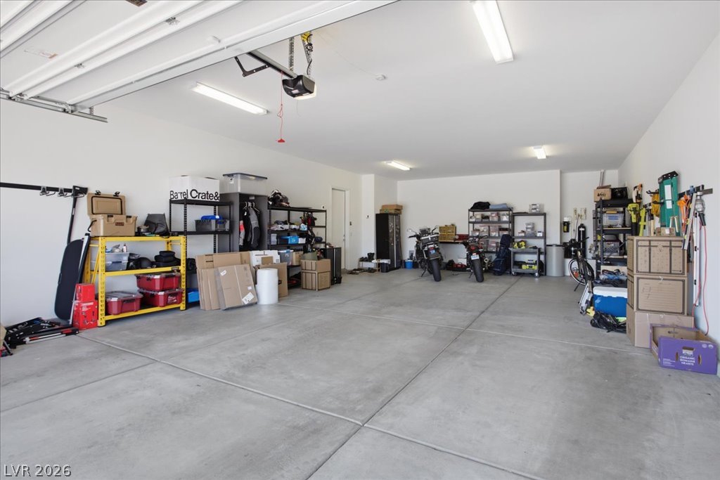 20 Charlotte Ridge Place Henderson, NV 89011 - Photo 31 of 33 Secure garage with ample storage space and durable concrete flooring.