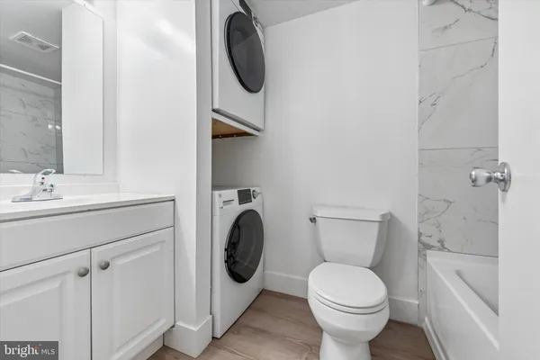 a bathroom with a toilet and a sink