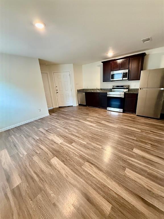 812 South 22nd Street Temple, TX 76501 - Photo 8 of 34 a view of kitchen with wooden floor