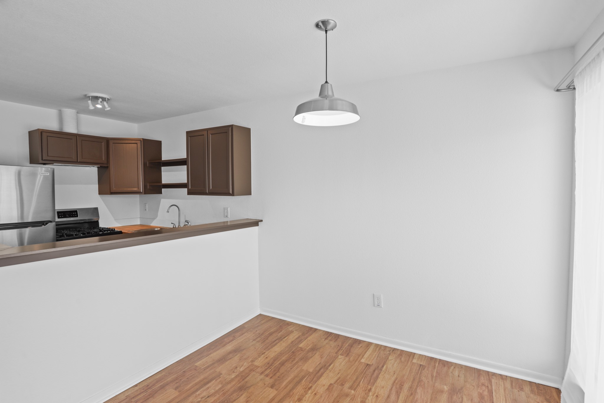 1408 Hughes Street, Unit 4 Houston, TX 77023 - Photo 15 of 27 The kitchen is open to the dining area so the chef is always part of the party.