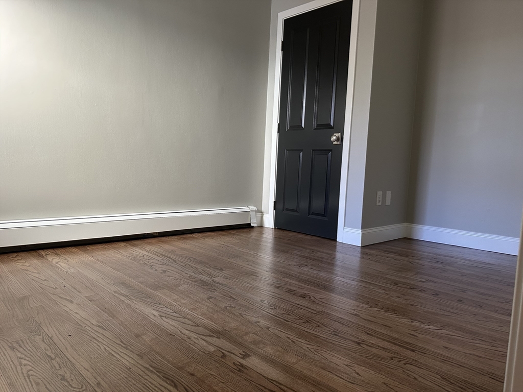 18 Ashcroft Street, Unit 301 Dedham, MA 02026 - Photo 13 of 14 a view of a livingroom with wooden floor