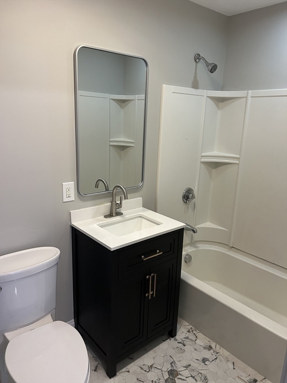 18 Ashcroft Street, Unit 301 Dedham, MA 02026 - Photo 14 of 14 a bathroom with a sink toilet and shower