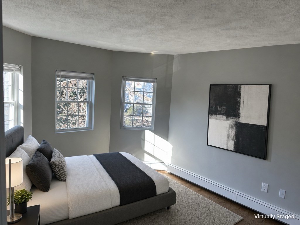 18 Ashcroft Street, Unit 301 Dedham, MA 02026 - Photo 3 of 14 a bedroom with a bed and window