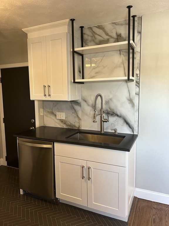 18 Ashcroft Street, Unit 301 Dedham, MA 02026 - Photo 6 of 14 a close view of sink and tap