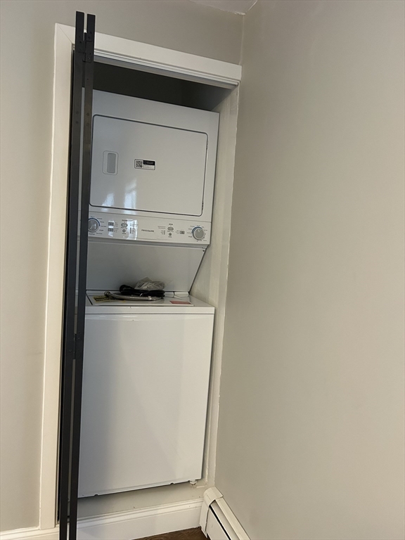 18 Ashcroft Street, Unit 301 Dedham, MA 02026 - Photo 10 of 14 a utility room with a washer and dryer