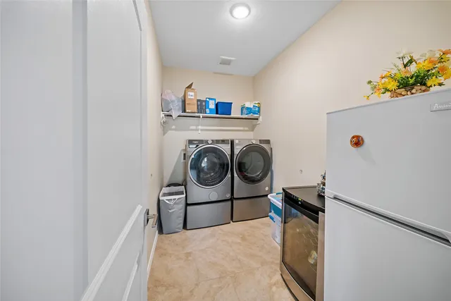a utility room with dryer and washer