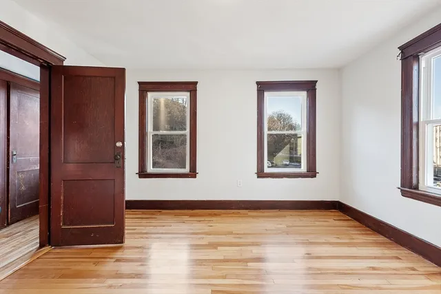 a view of a room with wooden floor and gate
