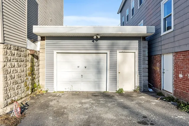 a view of a room with wooden floor and windows