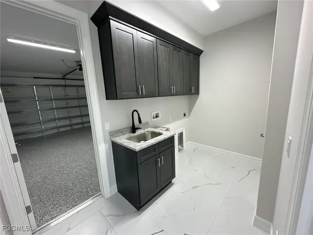 a kitchen with a sink and cabinets