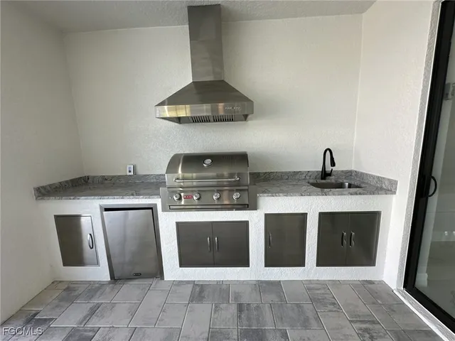 a kitchen with a stove and a sink
