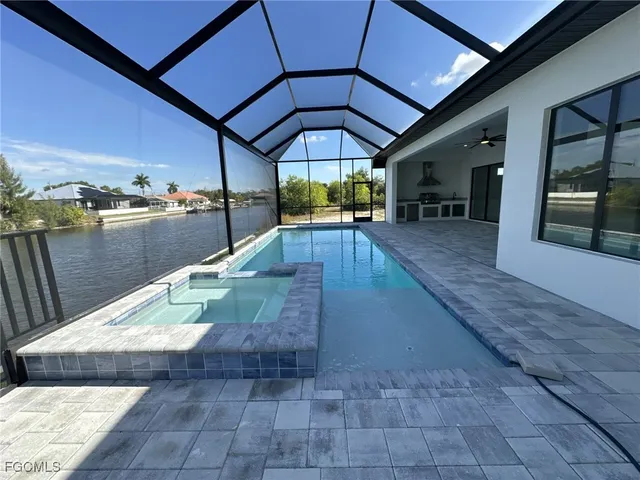 a view of a swimming pool with a patio