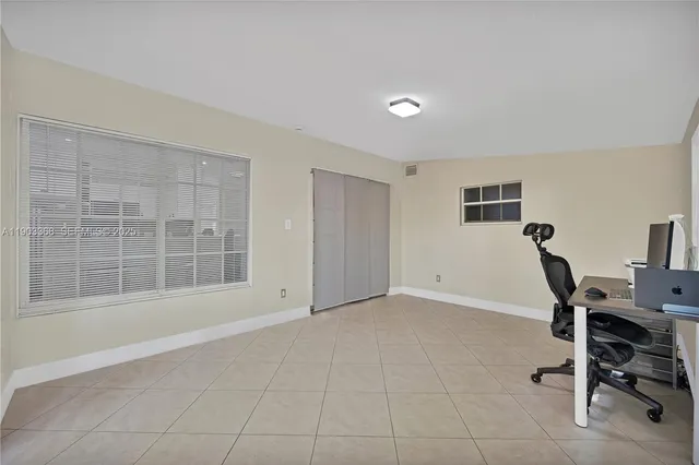 a view of a backyard with sitting area