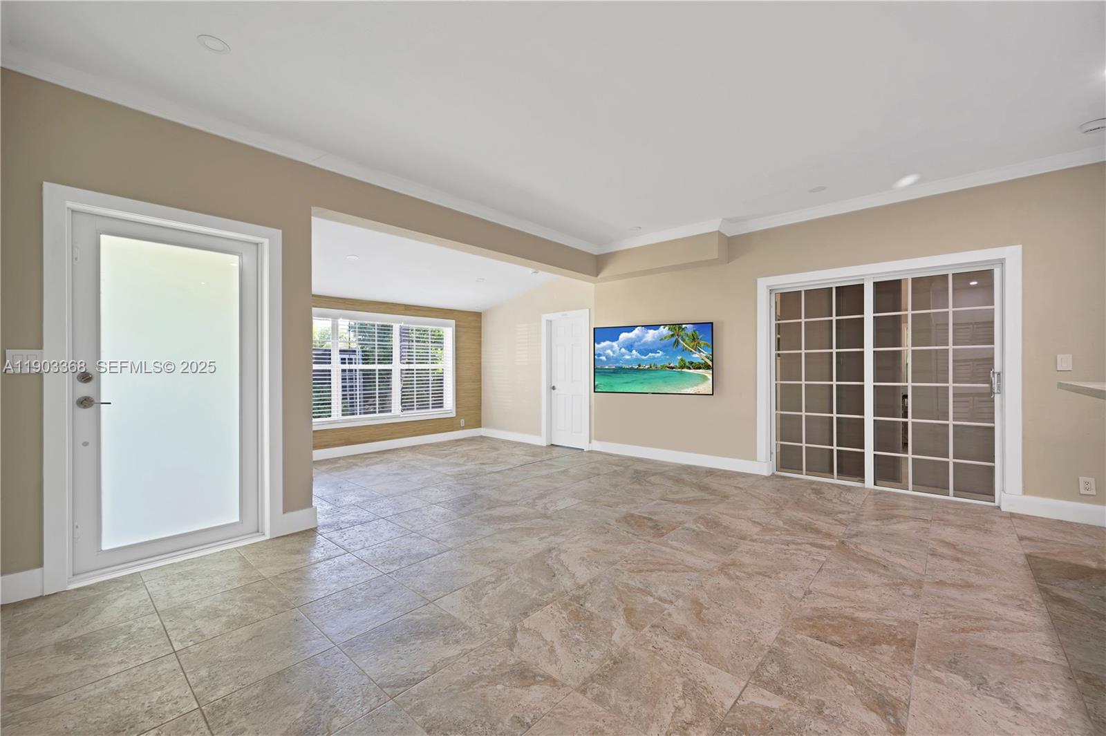 818 Northeast 3rd Street Hallandale Beach, FL 33009 - Photo 2 of 24 a view of an empty room with a window