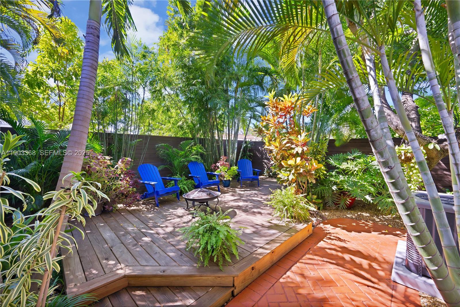 818 Northeast 3rd Street Hallandale Beach, FL 33009 - Photo 21 of 24 a view of a backyard with sitting area