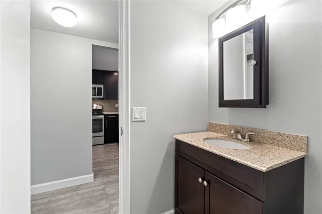 a bathroom with a sink and a mirror