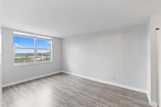 a view of an empty room with a window