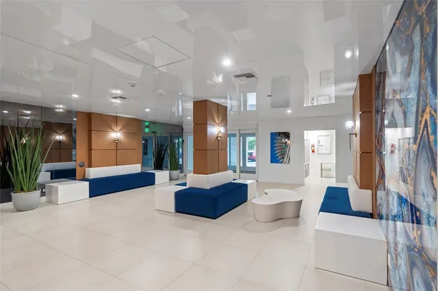 a lobby with furniture and a large window