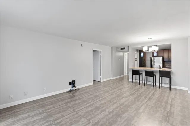 a view of a livingroom with furniture and a window