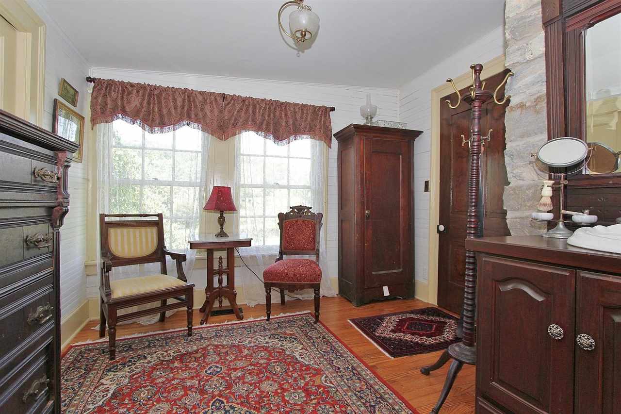 1108 Newport Road Raphine, VA 24472 - Photo 17 of 50 a living room with furniture a window and a fireplace