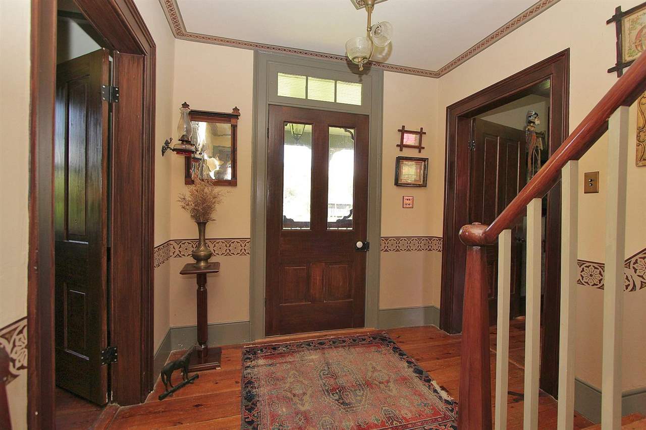 1108 Newport Road Raphine, VA 24472 - Photo 20 of 50 a view of a hallway with a chandelier and living room