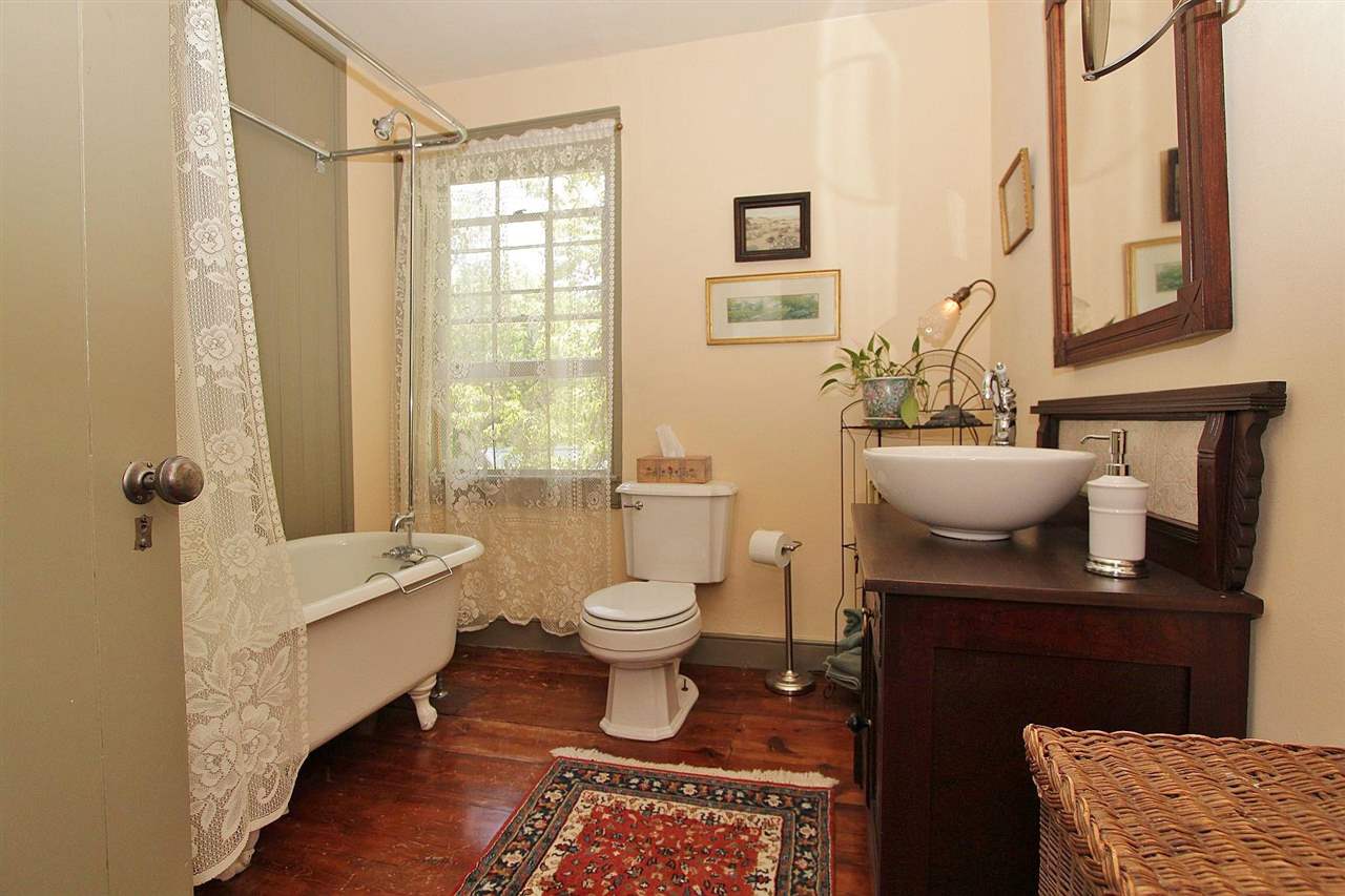 1108 Newport Road Raphine, VA 24472 - Photo 24 of 50 a bathroom with a granite countertop sink toilet and shower