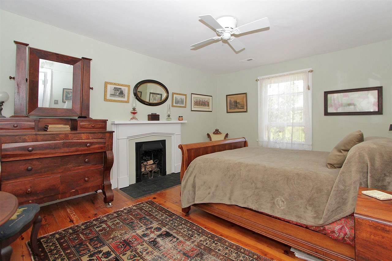 1108 Newport Road Raphine, VA 24472 - Photo 27 of 50 a bed room with a bed and a fireplace