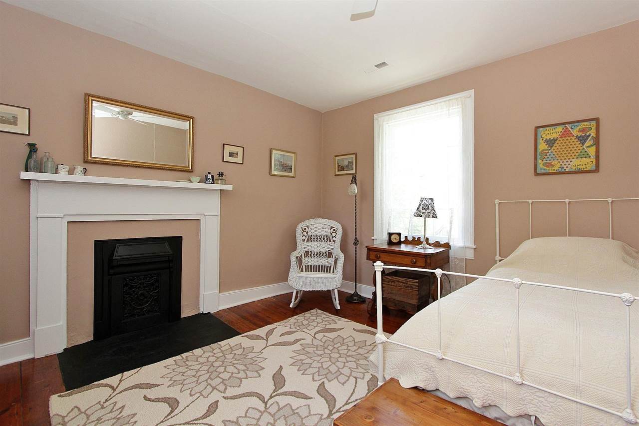 1108 Newport Road Raphine, VA 24472 - Photo 28 of 50 a bedroom with a bed and a fireplace
